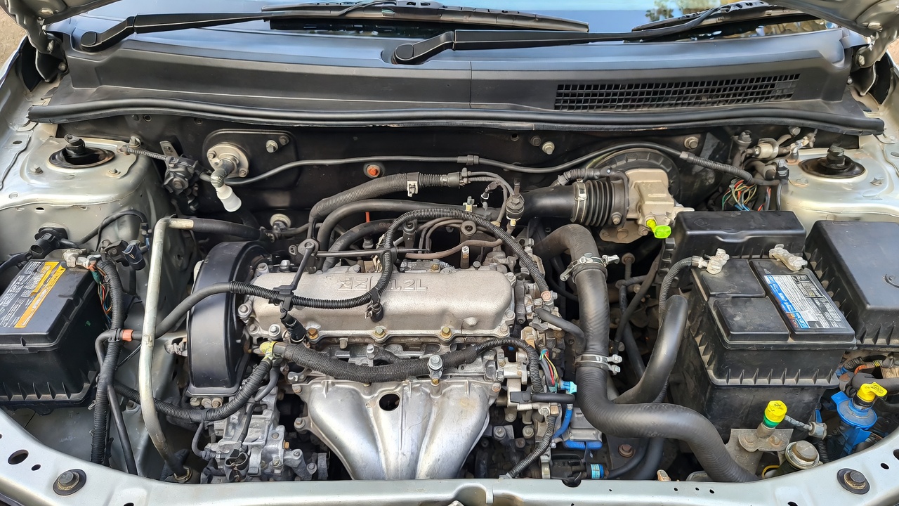 Tata Tiago 1.2L Revotron petrol engine close-up view.