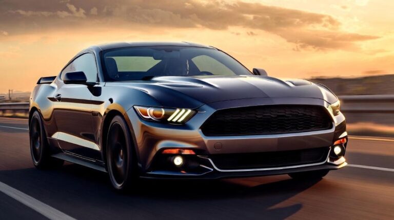 Modern Ford Mustang GT Fastback driving on a highway during sunset with its iconic fastback silhouette.