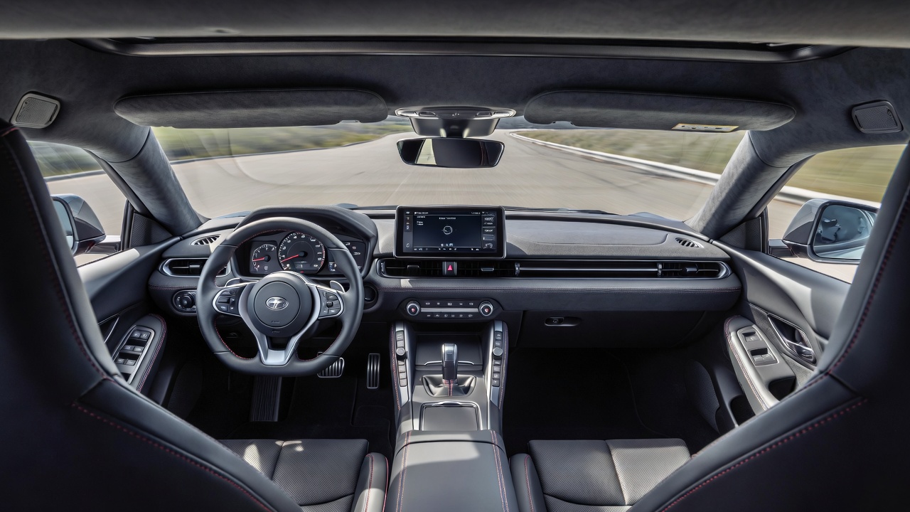 Toyota GR Supra driver-focused interior with digital instrument cluster and sport seats.