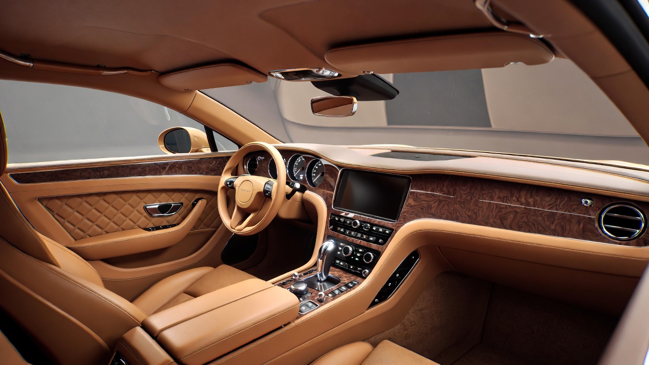 Handcrafted interior of Bentley Continental R with walnut veneer and leather upholstery.