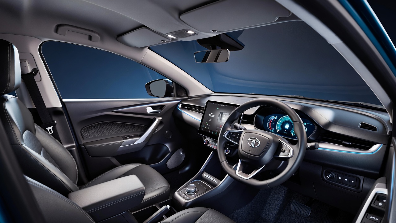 Premium interior cabin of Tata Nexon EV with digital dashboard.