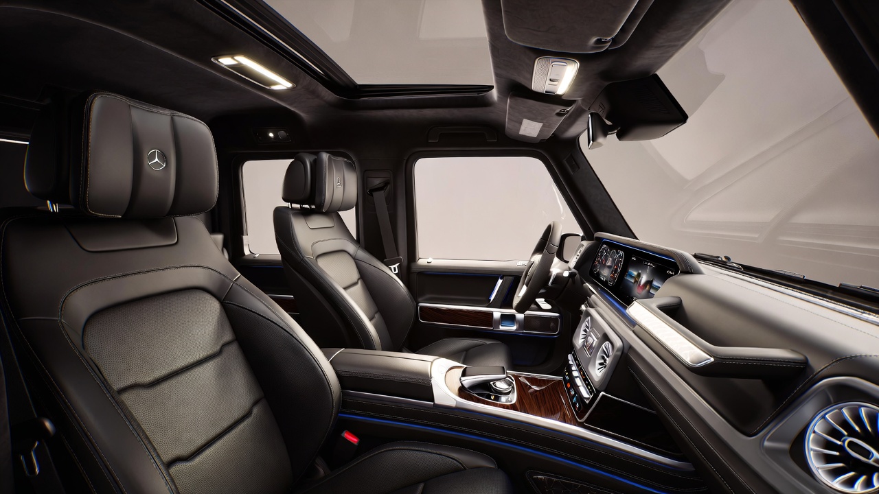 Luxury interior of Mercedes G-Wagon W463 with dual digital screens and premium leather seats.