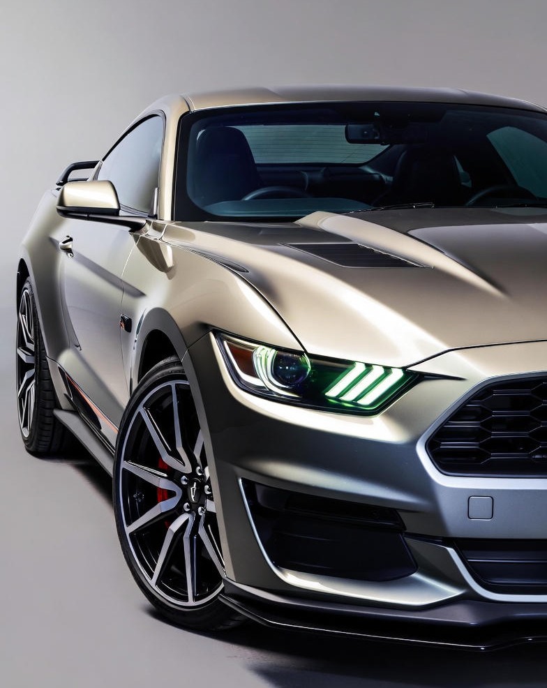 Close-up view of the modern Ford Mustang GT Fastback featuring LED headlights and muscular body lines.