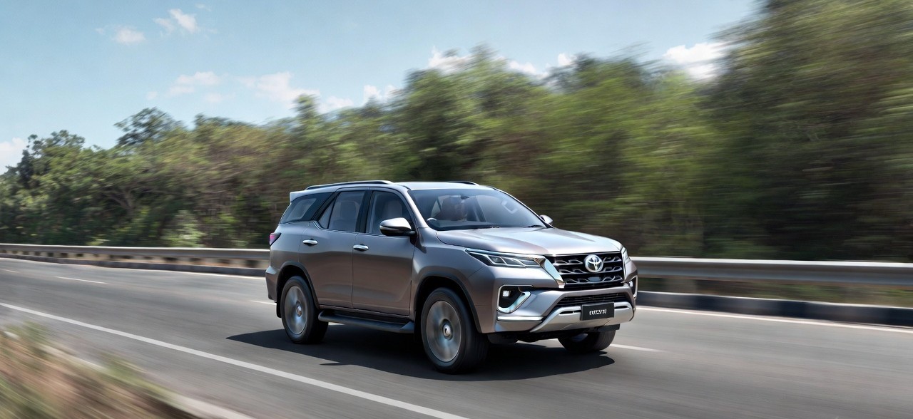 Toyota Fortuner driving on highway showing stable performance.