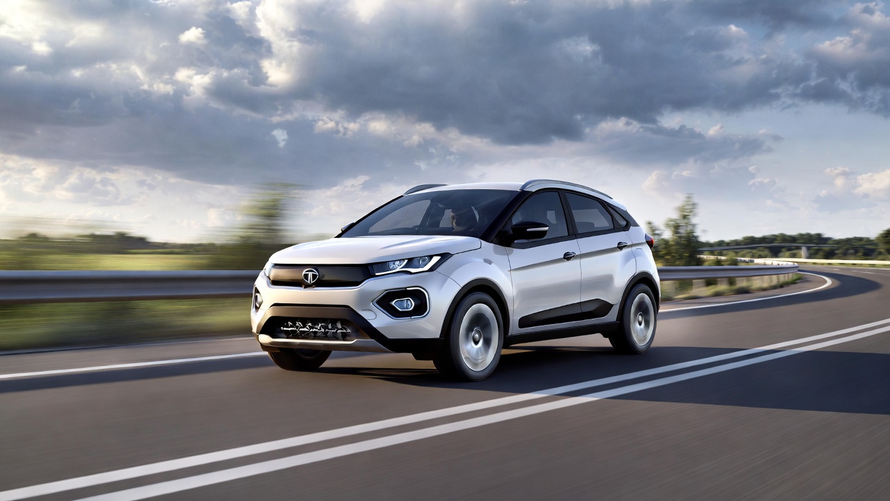 Tata Nexon EV accelerating on highway with motion blur.