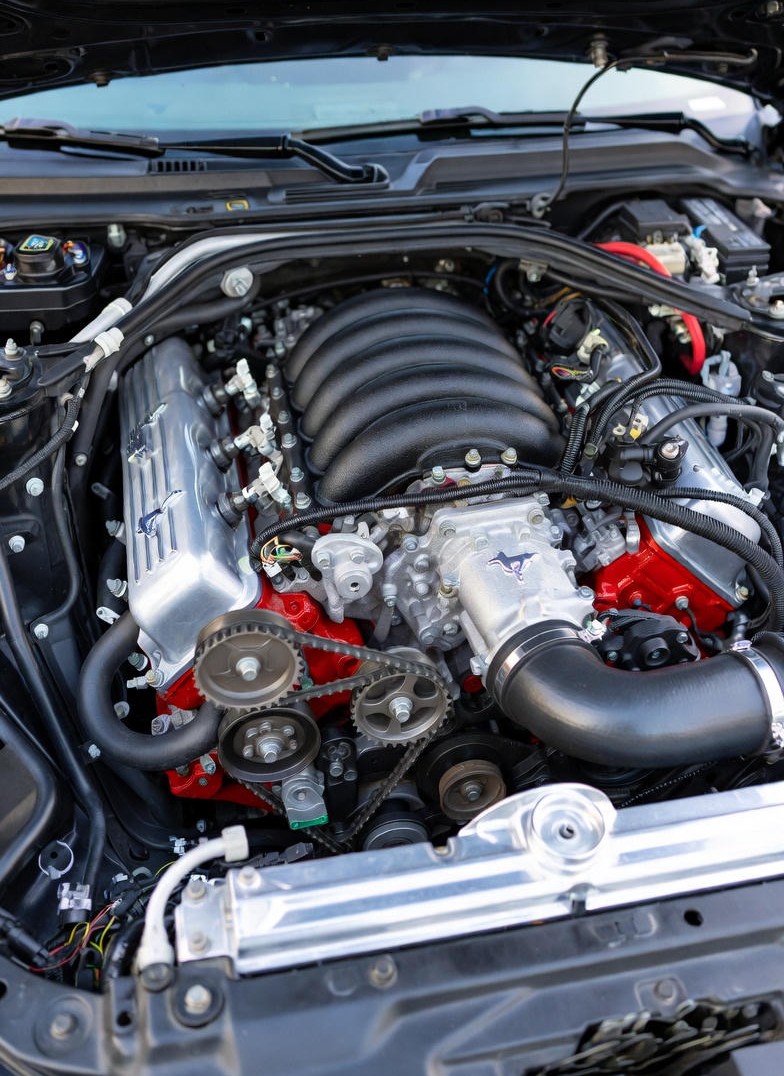5.0L Coyote V8 engine inside the Ford Mustang GT Fastback highlighting its performance-focused design.