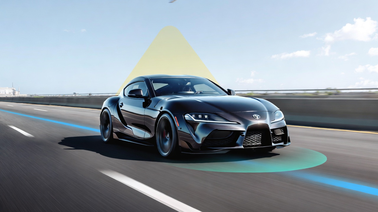 Toyota GR Supra with advanced driver assistance safety features on highway.