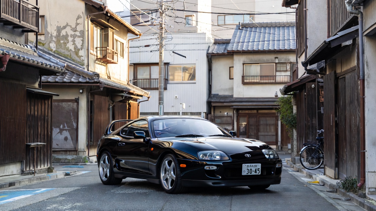 1990s Toyota Supra Mk4 representing Japanese sports car history.