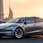 Lucid Air Review electric luxury sedan parked in a modern city at sunset