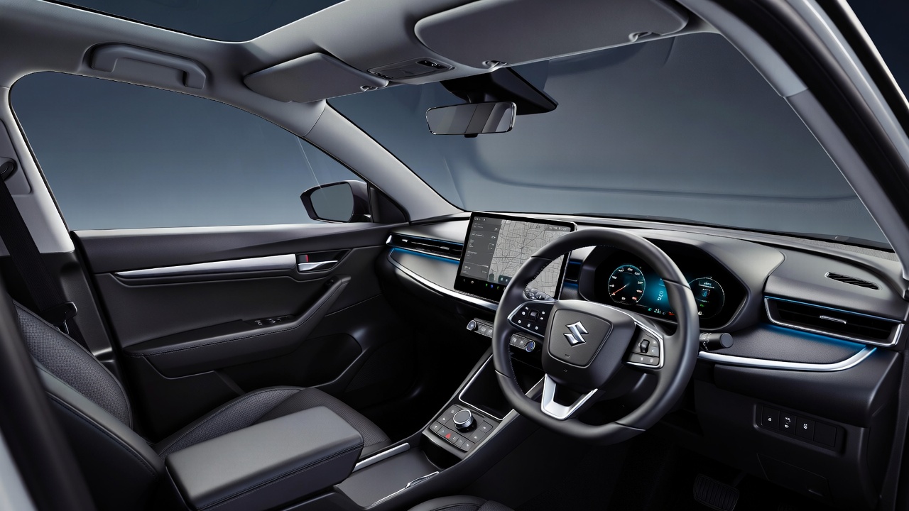 Maruti Suzuki e-Vitara interior with dual digital screens and ambient lighting.