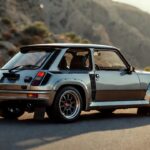 Renault 5 Turbo rally-inspired wide-body hatchback parked on a mountain road