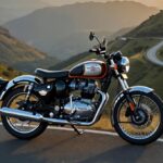 Royal Enfield Bullet 650 with chrome tank parked on a mountain road at sunrise.
