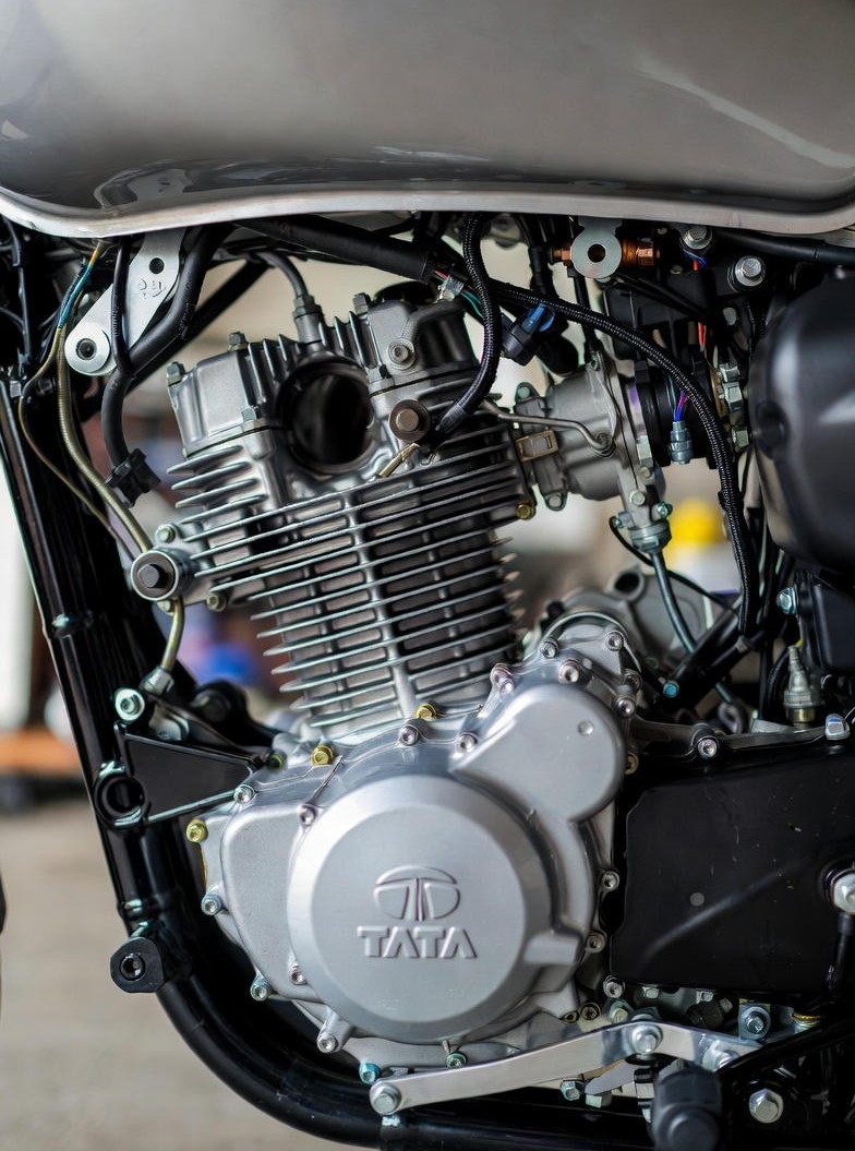 Tata 125cc bike engine close-up showing air-cooled technology