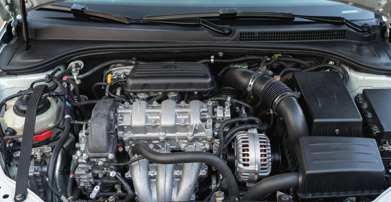 “Close-up detailed shot of 1.0 TSI turbo petrol engine inside Skoda Kylaq, clean engine bay, mechanical detail, automotive photography, high clarity, realistic lighting”