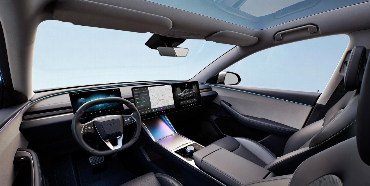 Mahindra XEV 9S interior triple screen dashboard layout.