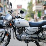 Indian commuter Tata Bike 125cc motorcycle parked on city street for daily use